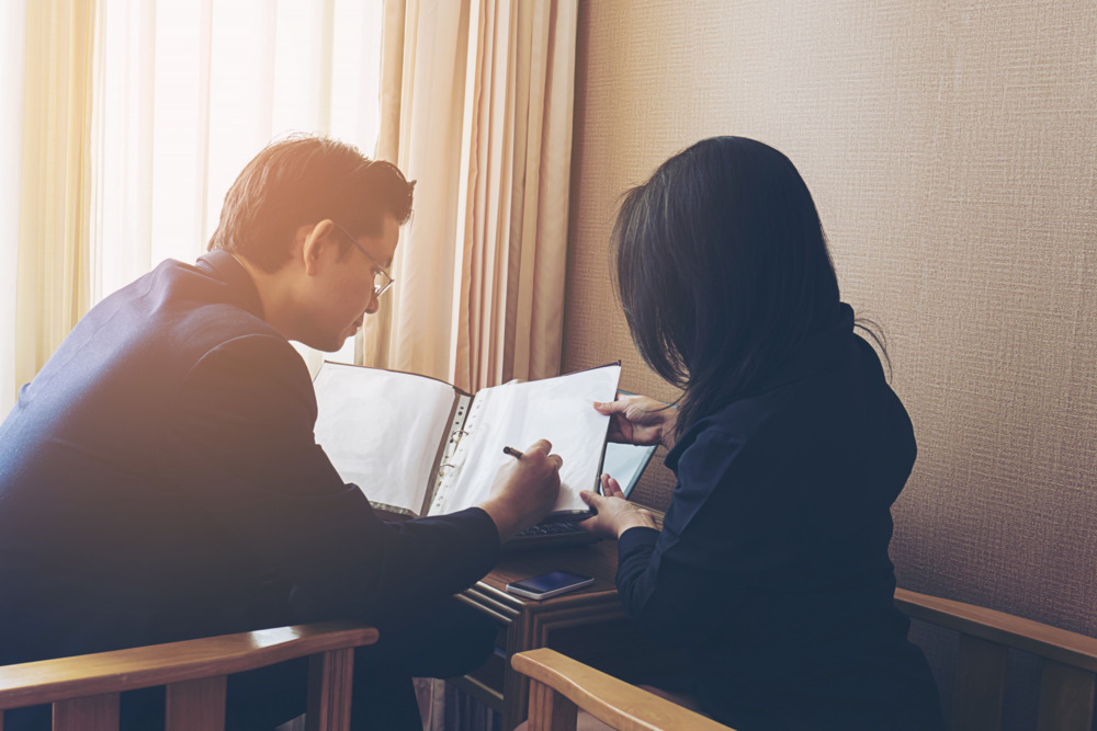Client consulting a will writing professional