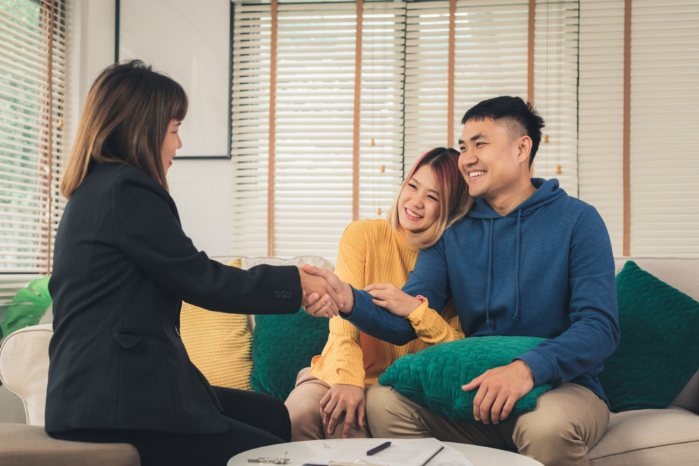 Couple consulting an adviser about a living trust
