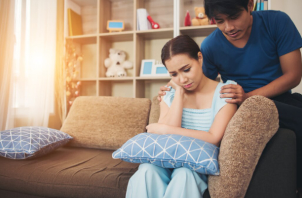 Couple facing inheritance-related family stress
